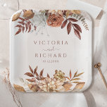Terracotta Rust Flowers Boho Fall Foliage Wedding Paper Plates<br><div class="desc">Infuse your fall wedding with earthy elegance and modern charm using these fall floral paper plates. These disposable plates feature a captivating design that blends beautifully with your bohemian or rustic autumn theme. Watercolor illustrations of burnt orange florals, copper-toned leaves, and pampas grass are accented with modern, elegant calligraphy, creating...</div>