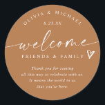 Terracotta Wedding Welcome Hotel Bag Classic Round Sticker<br><div class="desc">Terracotta Hotel Bag Stickers: Warm and contemporary, these terracotta modern handwriting stickers bring a rich, earthy elegance to your wedding welcome gifts. The 3-inch round design reads “welcome friends & family” with a sweet heart detail and personalized names and date. The terracotta background and handwritten script combine rustic warmth with...</div>