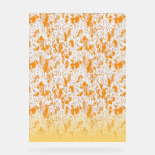 Textile pattern featuring a vibrant orange and gol acrylic sign
