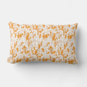 Textile pattern featuring a vibrant orange and gol lumbar pillow