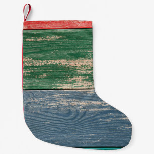 Texture of color wooden surface as background, top small christmas stocking