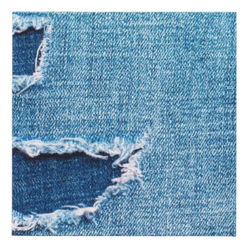 Textured denim background Torn hole in the fabric Faux Canvas Print
