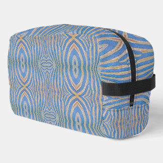 Textured, symmetrical blue and gold zebra pattern dopp kit
