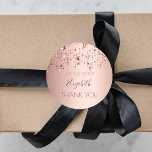 Thank You birthday party rose gold glittery stars Classic Round Sticker<br><div class="desc">A sticker, favor tag for a girly birthday. A faux rose gold metallic looking background with an elegant rose gold, copper colored dripping shining stars. The text: Thank You. Template for name and a date. The name is written in dark rose gold with a large modern hand lettered style script....</div>