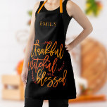 Thankful Grateful Blessed Name Orange Yellow Black Apron<br><div class="desc">Thankful Grateful Blessed Name Orange Yellow Black> Awesome inspirational words to wear for thanksgiving and throughout the year, I n a large elegant script, the words of gratitude Thankful Grateful Blessed in the vibrant colors of fall on a black background which can be changed to another color if you so...</div>