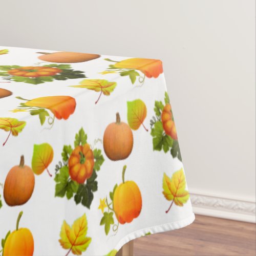 Thanksgiving Pumpkins and Fall Leaves on White Tablecloth