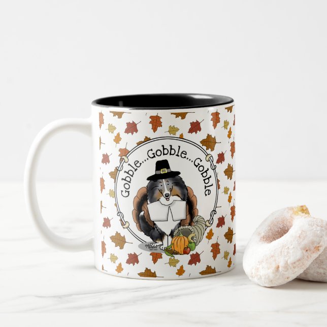 Thanksgiving Shetland Sheepdog (blue merle) Funny Two-Tone Coffee Mug (With Donut)
