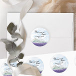 The Adventure Begins Lavender Valley Wedding Classic Round Sticker<br><div class="desc">The Adventure Begins, personalized wedding stickers, perfect for a mountain wedding resort or destination wedding in scenic countryside. The design features modern typography and an idyllic watercolor landscape. The dreamy mountain ridge scene depicts mountains, green hills and a peaceful country valley meadow with swathes of lavender, purple wildflowers or highland...</div>