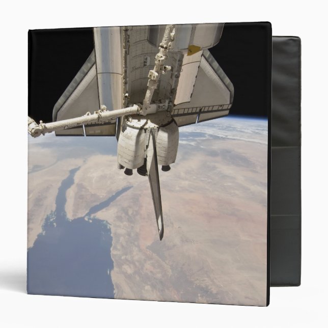 The aft section of the docked space shuttle 3 ring binder (Front/Inside)