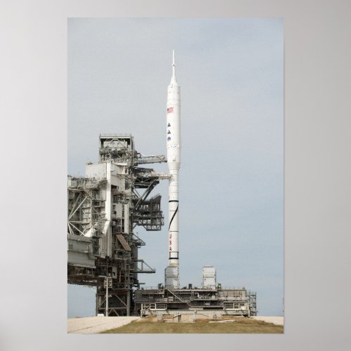 The Ares I_X rocket is seen on the launch pad Poster