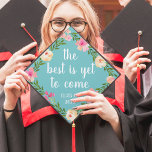 The Best is Yet to Come | Custom Class Year Graduation Cap Topper<br><div class="desc">Cute grad cap topper features the quote "the best is yet to come" in white brush script lettering on a vibrant turquoise aqua background adorned with pink watercolor flowers and green foliage. Personalize with your class year.</div>