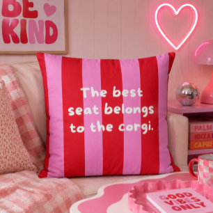 'The Best Seat Belongs To The Corgi.' Red & Pink Throw Pillow