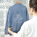 The Bride Elegant Script Brides Name Wedding Date Denim Jacket<br><div class="desc">Our minimal and elegant "The Bride" wedding denim jacket features modern script calligraphy "The Bride". Designed to make heads turn on your special day. Whether you're a trendsetter bride or looking for the perfect gift for the bride-to-be, this jacket is a must-have addition to your wedding ensemble. So why settle...</div>