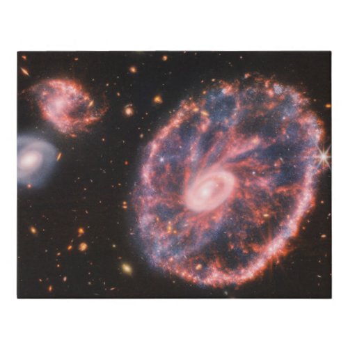 The Cartwheel Galaxy And Its Companion Galaxies Faux Canvas Print