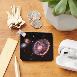 The Cartwheel Galaxy And Its Companion Galaxies. Keychain