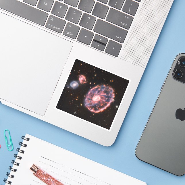The Cartwheel Galaxy And Its Companion Galaxies. Sticker (Laptop w/ iPhone)