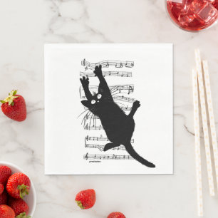 The cat hangs on musical notes napkins