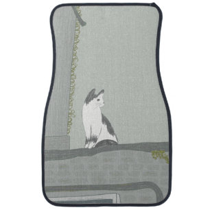The cat on the fence car floor mat