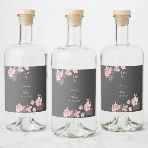 The chic pink sakura flowers on a dark gray wine l liquor bottle label