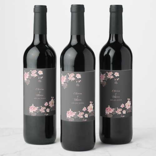 The chic pink sakura flowers on a dark gray wine label