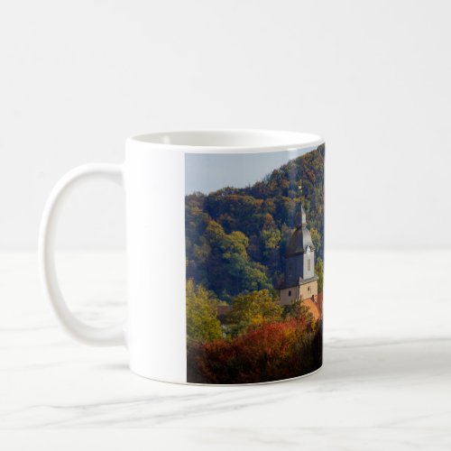 The church tower of Herleshausen in autumn coffee  Coffee Mug