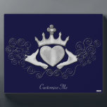 The Claddagh (Silver) Plaque<br><div class="desc">The Claddagh's distinctive design features two hands clasping a heart, and usually surmounted by a crown. The elements of this symbol are often said to correspond to the qualities of love (the heart), friendship (the hands), and loyalty (the crown). Often given in ring form, the Claddagh may be used for...</div>