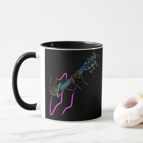 The colored silhouette of a guitar and guitarist mug