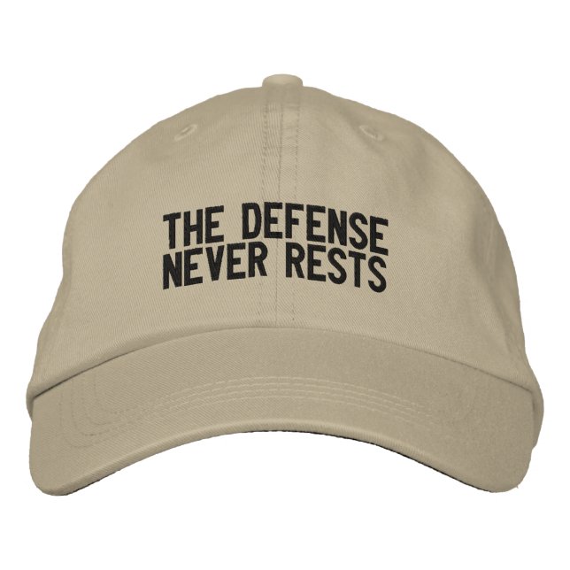 The defense never rests embroidered baseball cap (Front)