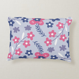 The dominant colors are shades of blue and pink accent pillow
