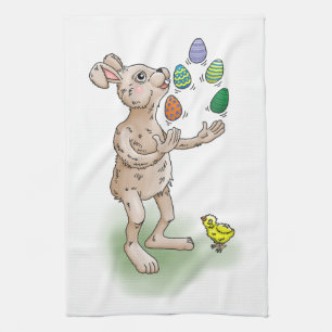 The Easter Bunny juggles with the Easter eggs Kitchen Towel