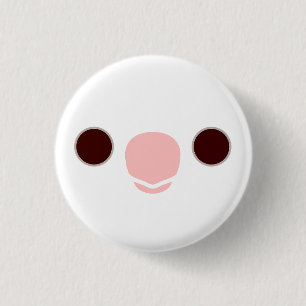 The face of a albino cockatiel button