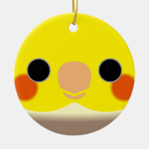 The face of a cinnamon pied male cockatiel ceramic ornament