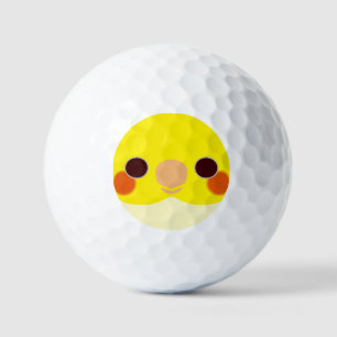 The face of a lutino cockatiel golf balls