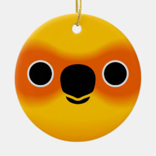 The face of a Sun Conure Ceramic Ornament