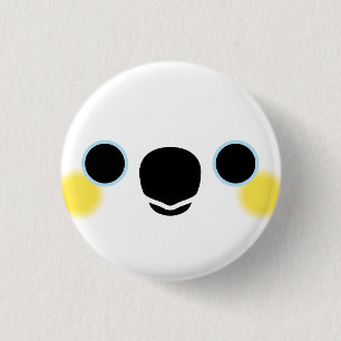 The face of a Yellow-crested cockatoo Button