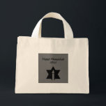 The Flame & Star - Mini Tote Bag<br><div class="desc">This image is a flame from a candle. A star around the flame represents Hanukkah. Done in a black tattoo. A black backround was also added. "Happy Hanukkah 2014" is printed on this design. Customize with your own words. These totes are available in assorted styles,  colors and sizes.</div>