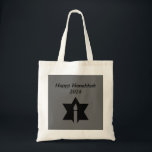 The Flame & Star - Tote Bag<br><div class="desc">This image is a flame from a candle. A star around the flame represents Hanukkah. Done in a black tattoo. A black backround was also added. "Happy Hanukkah 2014" is printed on this design. Customize with your own words. These totes are available in assorted styles,  colors and sizes.</div>