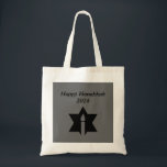 The Flame & Star - Tote Bag<br><div class="desc">This image is a flame from a candle. A star around the flame represents Hanukkah. Done in a black tattoo. A black backround was also added. "Happy Hanukkah 2014" is printed on this design. Customize with your own words. These totes are available in assorted styles, colors and sizes.</div>