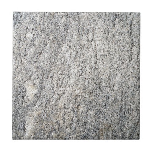 The flat surface of a gray granite stone ceramic tile