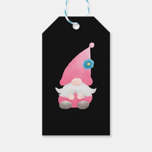 The gnome is wearing a pink dress   gift tags