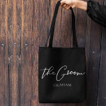 The Groom Personalized Chic Minimalist Wedding Tote Bag<br><div class="desc">This chic,  simple groom black tote bag features your name underneath elegant black typography reading The Groom. Customize these elegant,  modern bridal party gifts in white script for your wedding or bachelor party.</div>