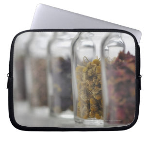 The herbs which a glass bottle contains laptop sleeve