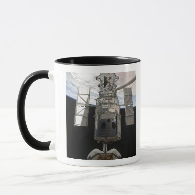 The Hubble Space Telescope is released Mug (Left)