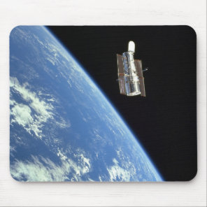 The Hubble Space Telescope with a blue earth Mouse Pad