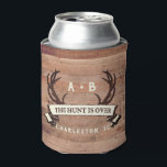 The Hunt's Over Custom Rustic Antler Wedding Favor Can Cooler<br><div class="desc">Custom Wedding Can Cooler, Wedding Favor - The Hunt is Over antlers banner design with personalized couple's initials, the bride and groom's names, wedding date, and location. To change the text, use the personalize option. For more extensive text changes such as changes to the font, font color, or text size...</div>
