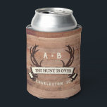 The Hunt's Over Custom Rustic Antler Wedding Favor Can Cooler<br><div class="desc">Custom Wedding Can Cooler, Wedding Favor - The Hunt is Over antlers banner design with personalized couple's initials, the bride and groom's names, wedding date, and location. To change the text, use the personalize option. For more extensive text changes such as changes to the font, font color, or text size...</div>