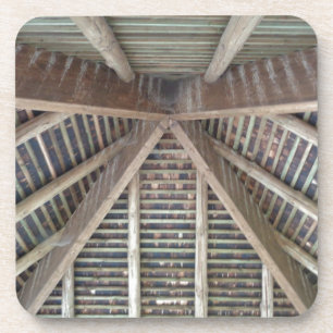 The inside of a wooden roof drink coaster