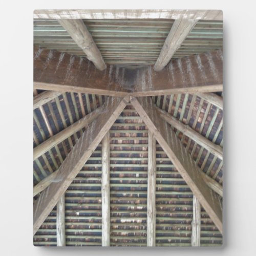 The inside of a wooden roof plaque