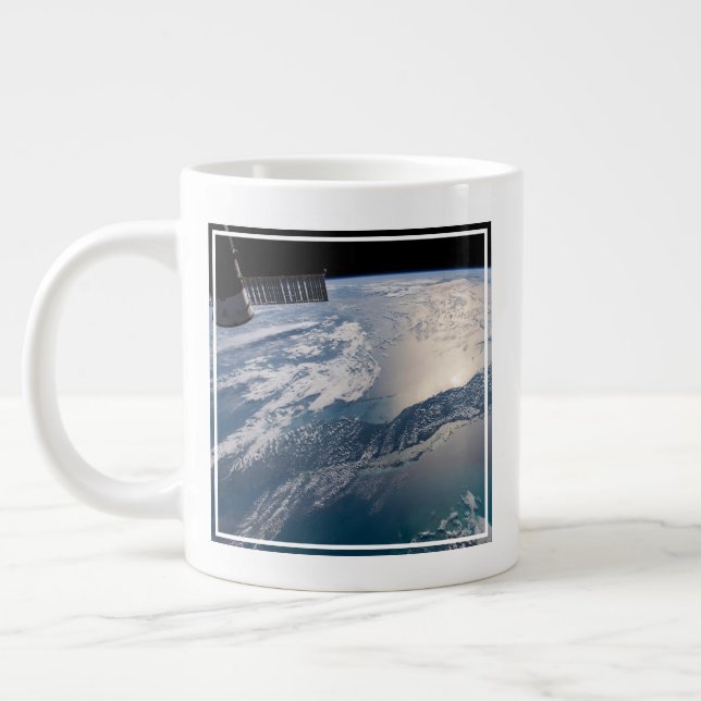 The International Spce Station Above The Atlantic Giant Coffee Mug (Left)