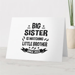 The little sister takes care of the big brother in card